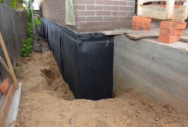 Happy homeowners after waterproofing job in Scotts